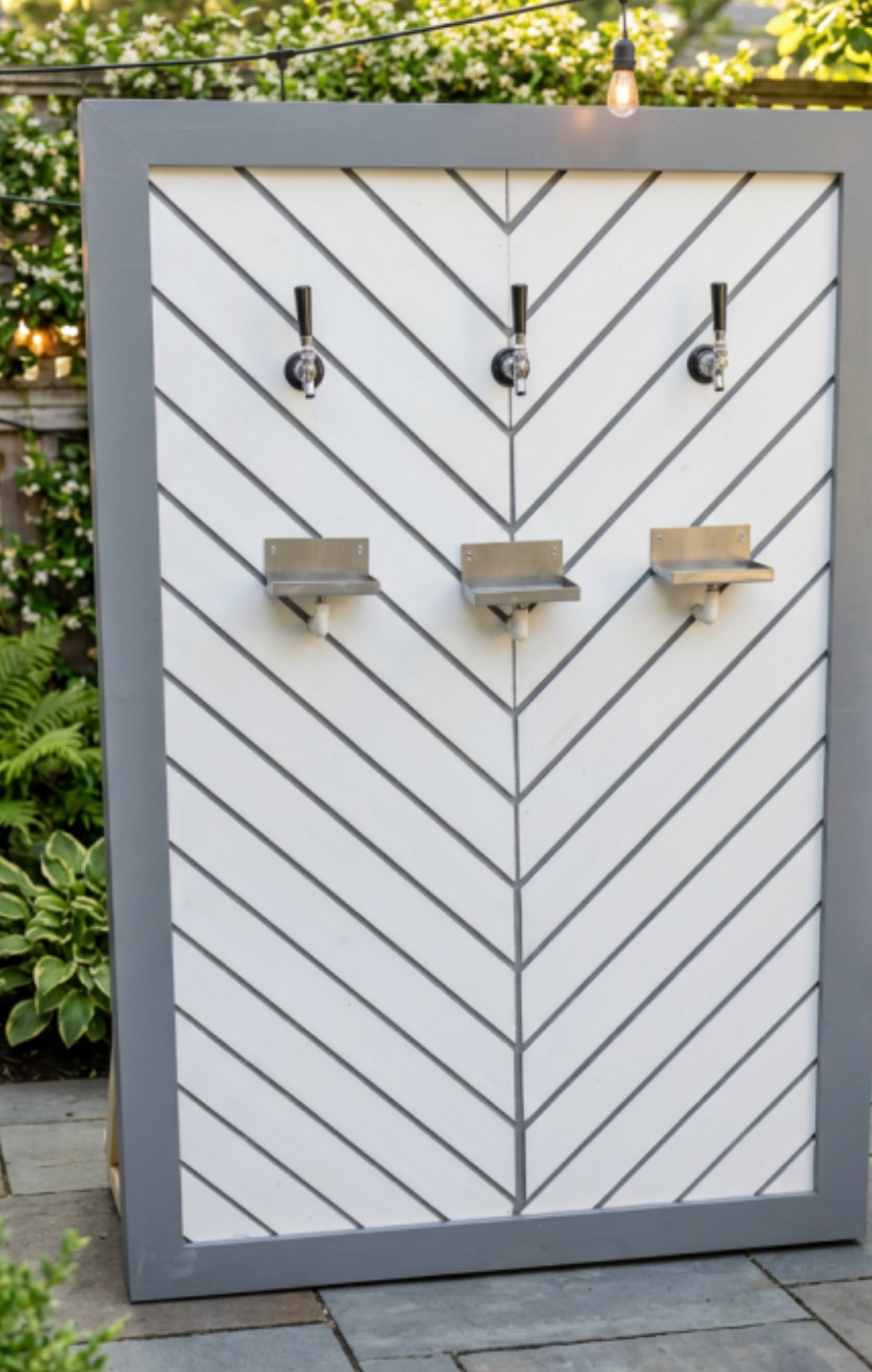 Tap-a-Keg three-tap beer wall with patio background